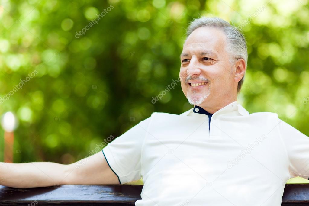 Elder man sitting on bench