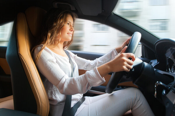 Young woman driving car