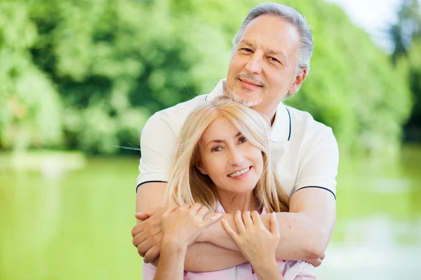 Mature couple relaxing outdoor — Stock Photo, Image