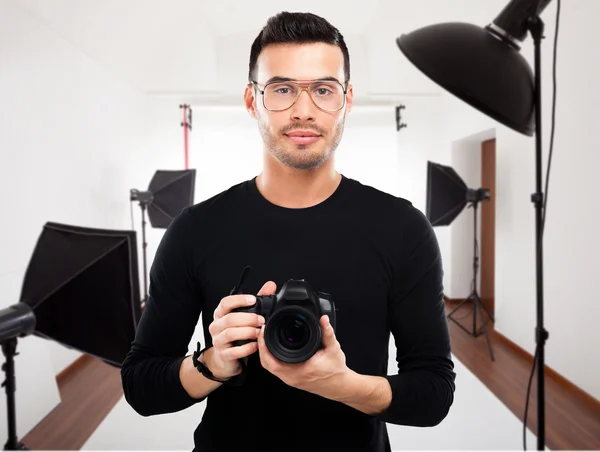 Professional photographer in studio — Stock Photo, Image