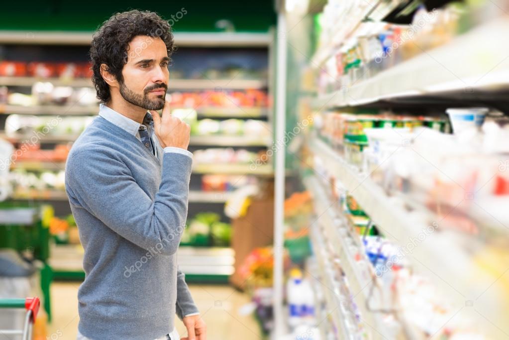 Man shopping in supermarket Stock Photo by ©minervastock 82310422
