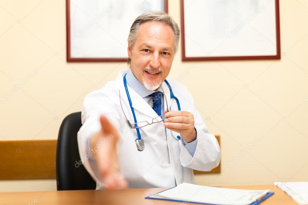 Doctor welcoming patient