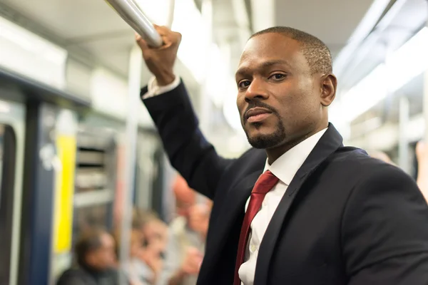 Businessman traveling in subway train — Stock Photo, Image