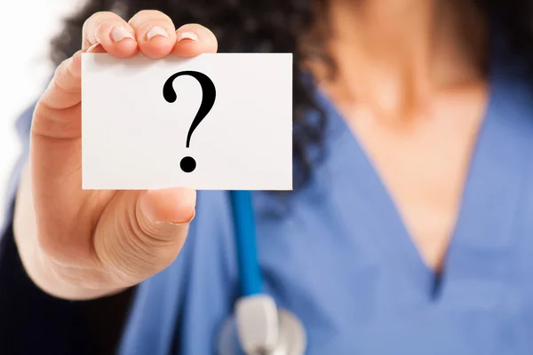 Nurse showing a business card — Stock Photo, Image