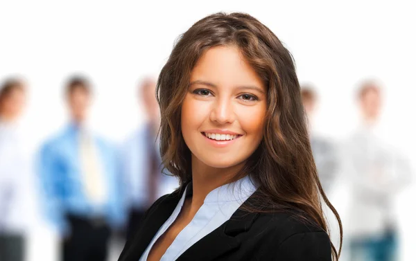 Woman in front of a group of people — Stock Photo, Image