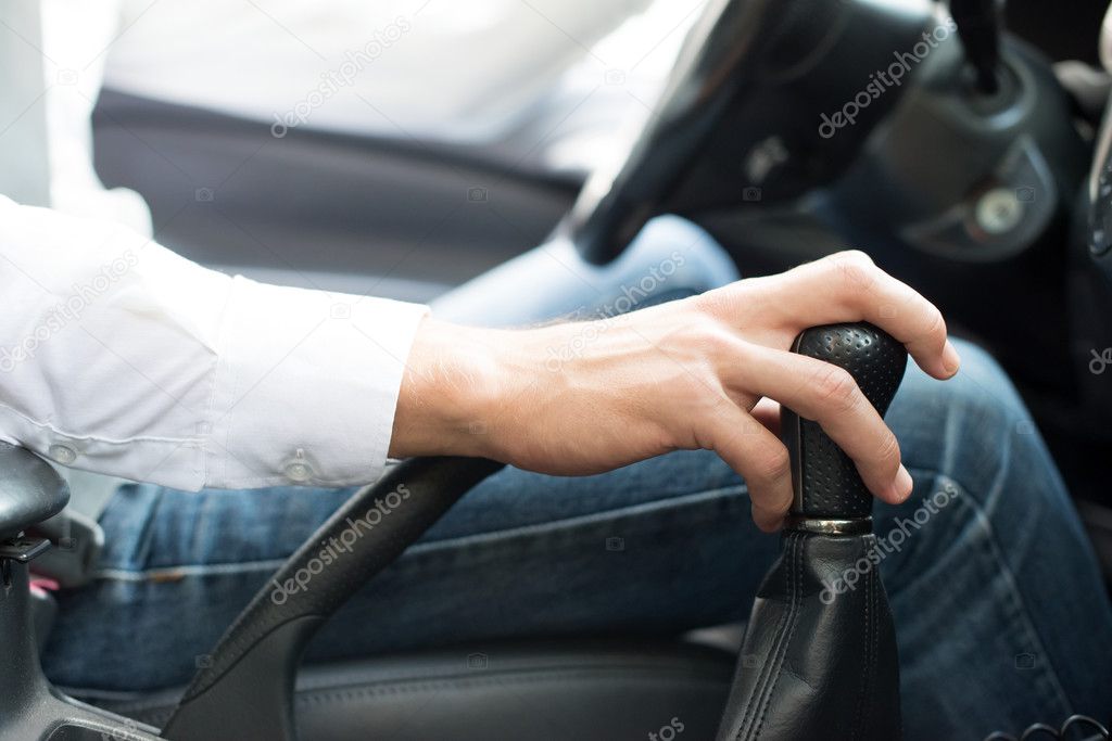 man driving his car