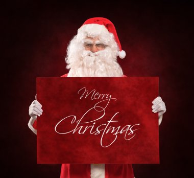 Noel Baba kırmızı bir işaret tutan