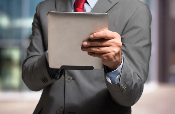 Businessman using his tablet — Stock Photo, Image