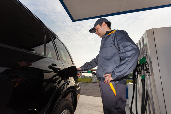 Gas station attendant at work