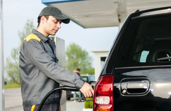 Gas station attendant at work — Stock Photo, Image