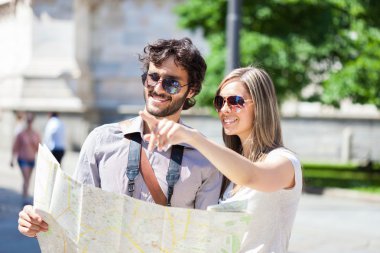 tourists reading a map clipart