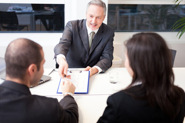 businessman showing a document