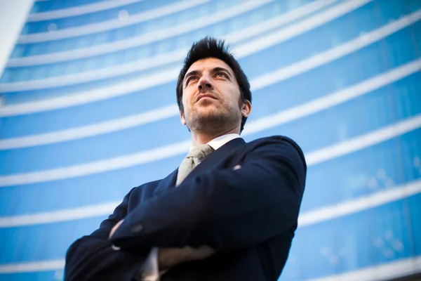 Confident businessman in front of building — Stock Photo, Image
