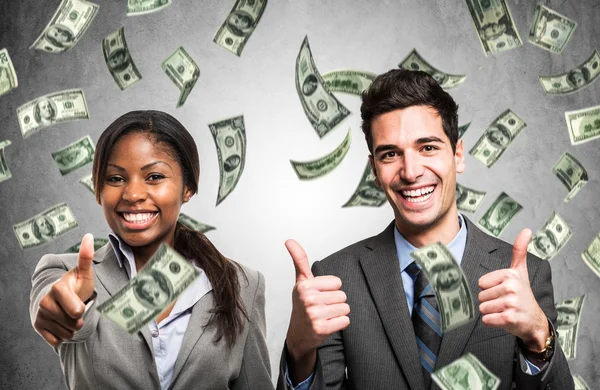 Man enjoying rain of money — Stock Photo, Image