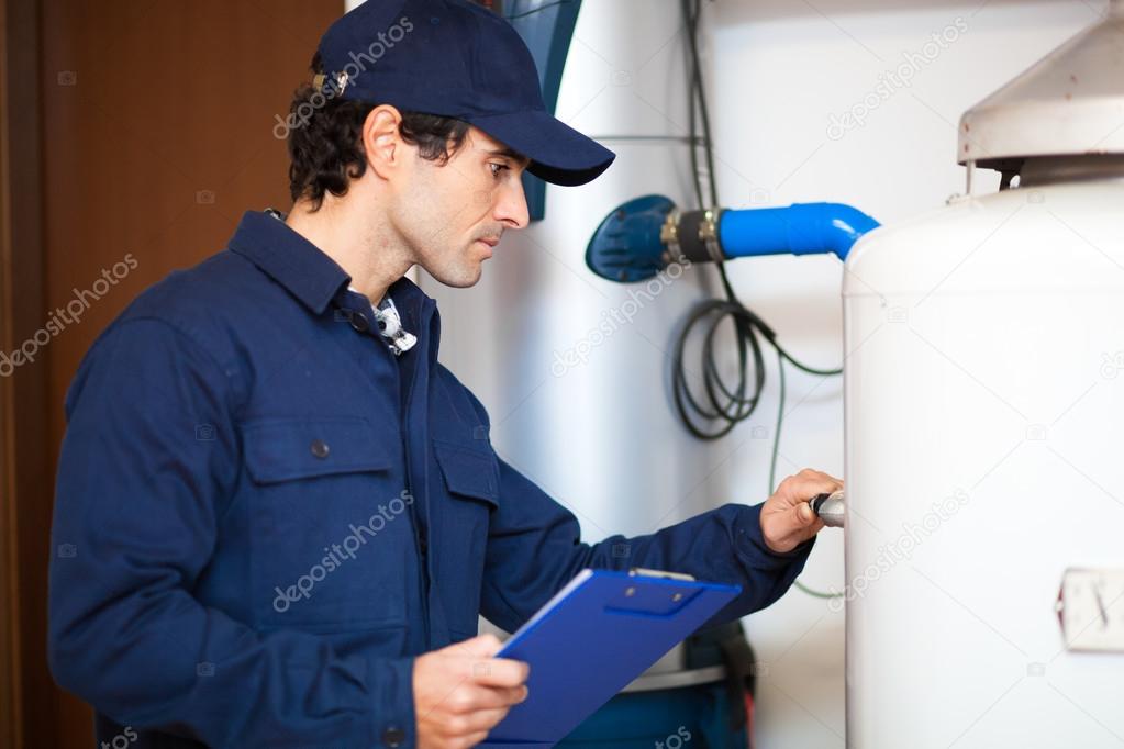 Technician fixing an hot-water heater