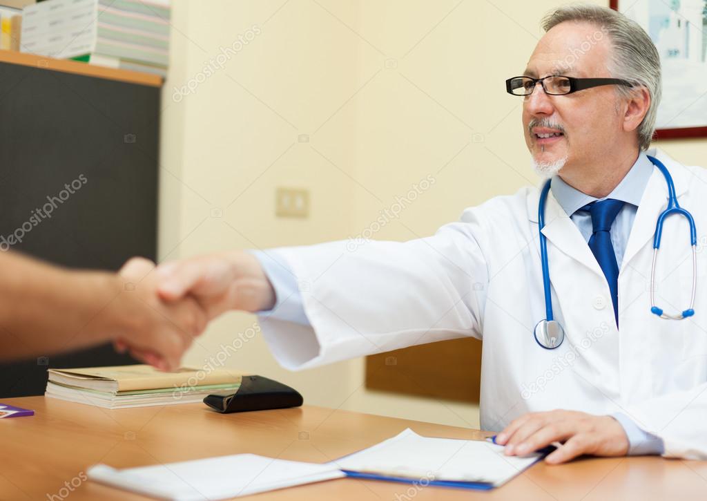 Doctor welcoming a patient