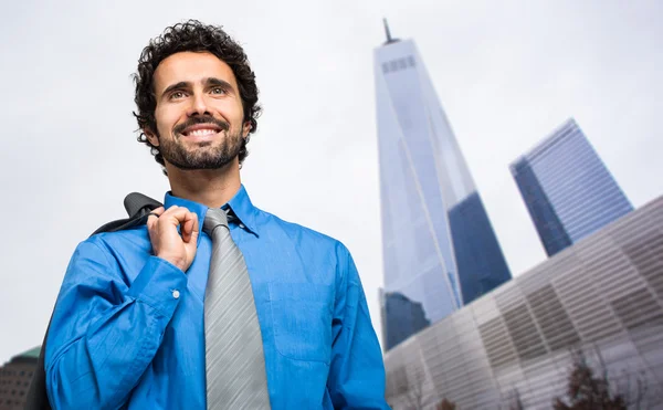 Handsome businessman in the city — Stock Photo, Image