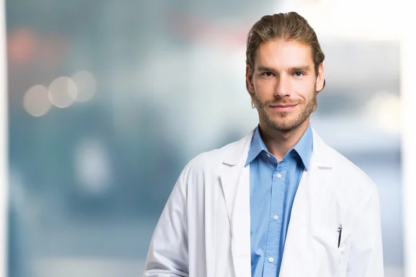Handsome smiling doctor — Stock Photo, Image