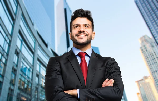 Handsome businessman in city — Stock Photo, Image