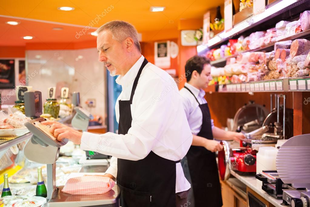 Shopkeepers working in grocery store