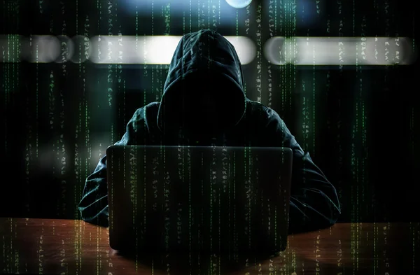 Hacker in front of his computer — Stock Photo, Image