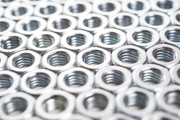 Metal nuts background — Stock Photo, Image