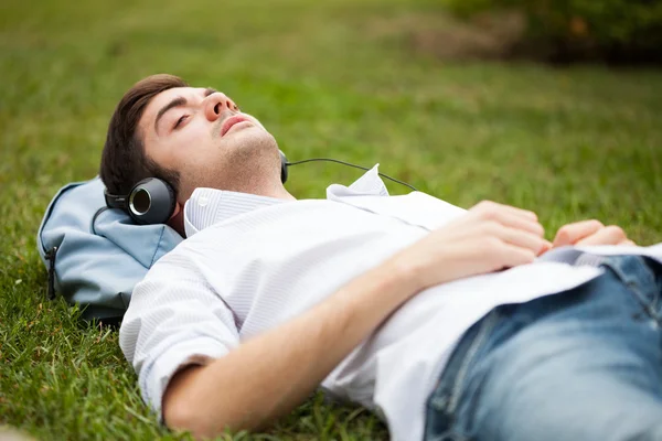 Young man listening music — Stock Photo, Image