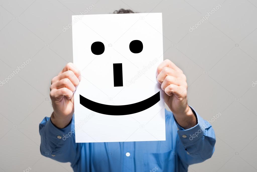 Man holding smiling face