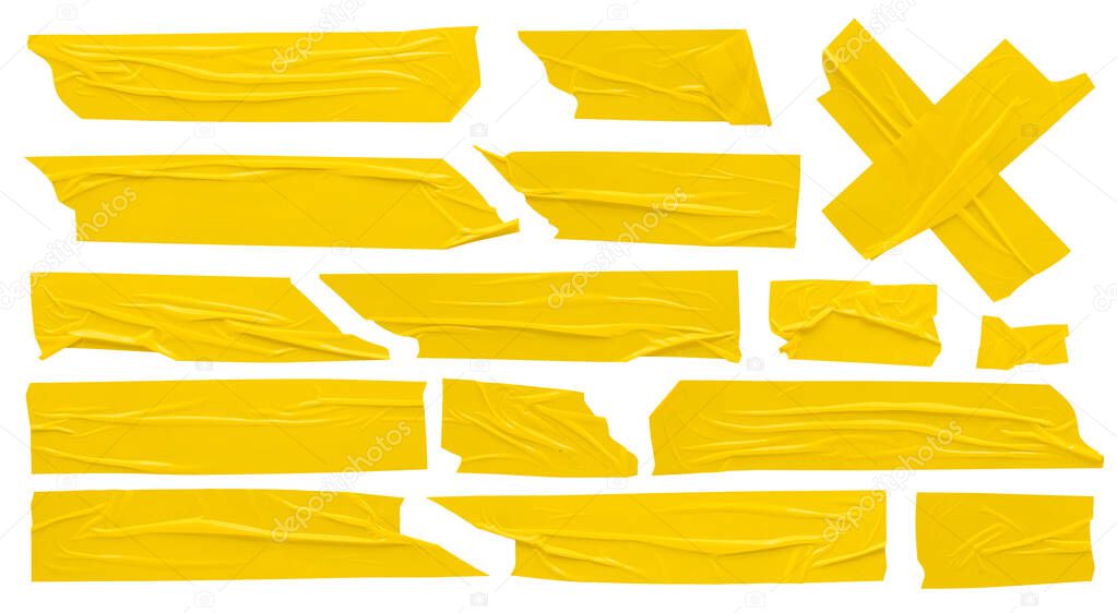 Yellow scotch, set of self-adhesive adhesive tape strips of various shapes and sizes on white background