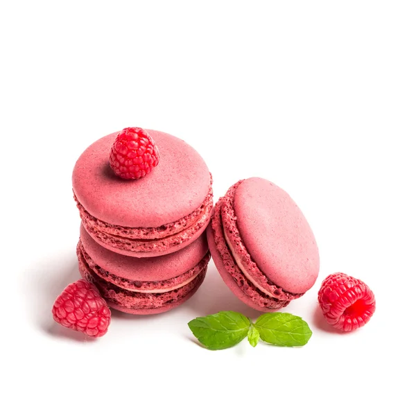 Tasty macaroons with raspberries on white background — Stock Photo, Image