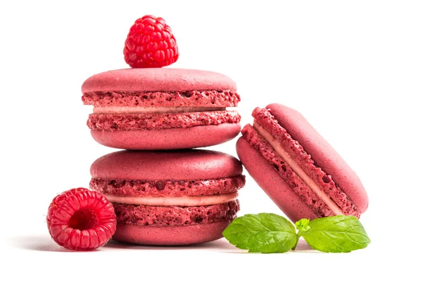 Fresh macaroons with raspberries on white background — Stock Photo, Image