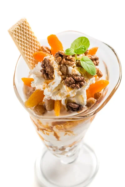 Ice cream with walnuts on white background — Stock Photo, Image