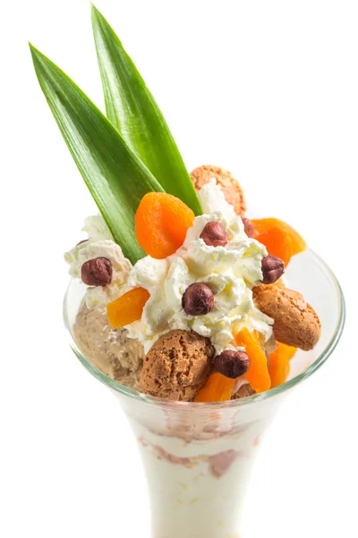 Hazelnut ice cream with cookies on a white background — Stock Photo, Image