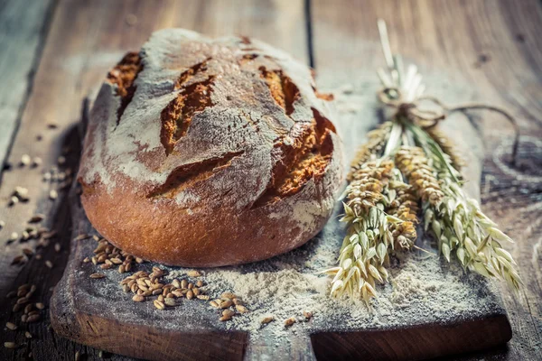 Delicious loaf of bread with wheat — Stock Photo, Image