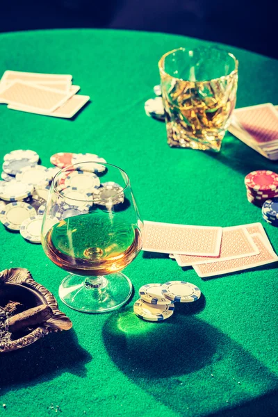 Old gambling table with chips and cards — Stock Photo, Image