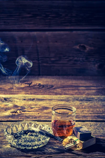 Vintage whiskey, cigarettes and ashtray — Stock Photo, Image