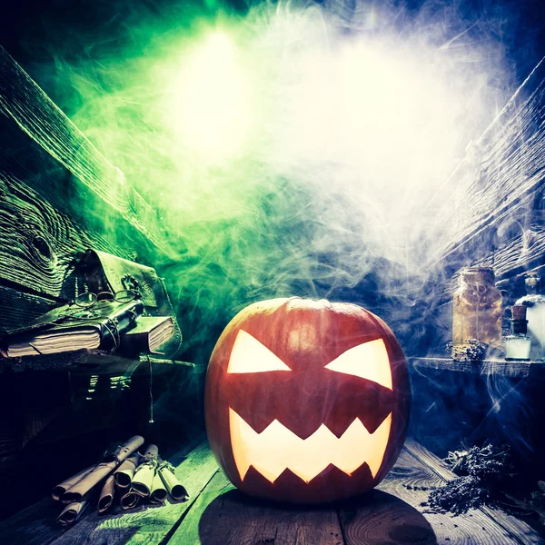 Spooky Halloween pumpkin in witcher labolatory with copy space — Stock Photo, Image
