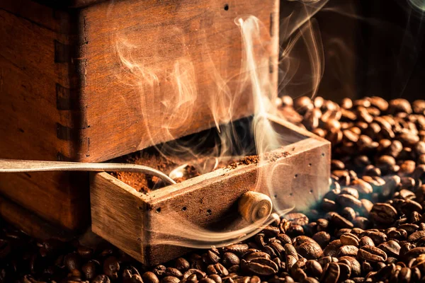 Closeup Roasted Coffee Beans Smoke Wooden Grinder — Stock Photo, Image