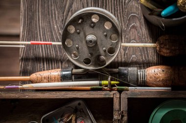 Vintage stuff for angler with rod and lures. Fishing equipment. Old wooden workshop fisherman. clipart