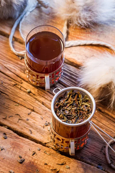 Warming tea served in old-fashioned — Stock Photo, Image