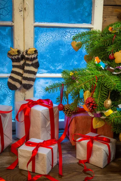 Christmas cottage full of gifts — Stock Photo, Image