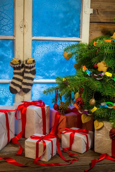 Christmas cottage full of gifts — Stock Photo, Image