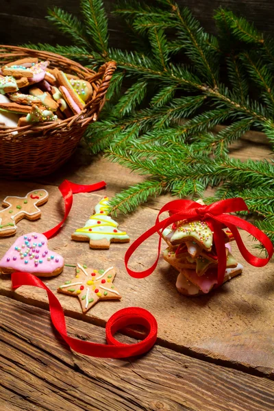 Red ribbon and gingerbread cookies for Christmas — Stock Photo, Image