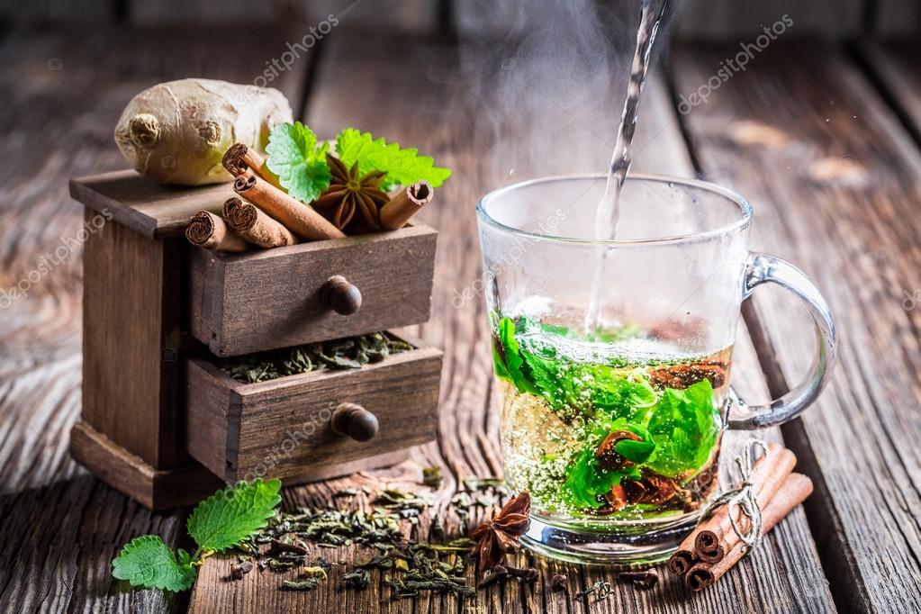 Brewing green tea with cinnamon — Stock Photo © Shaiith79 56497869