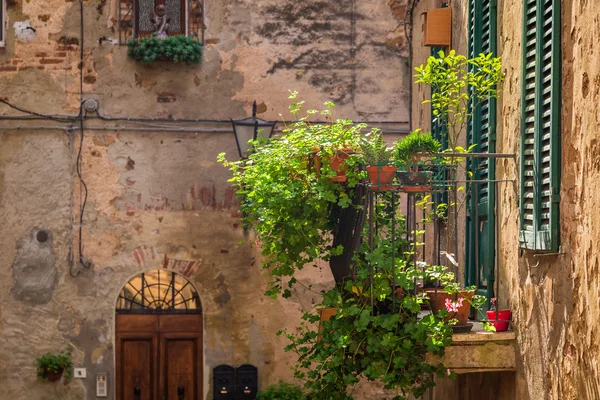 Beautiful balcony decorated with flowers in italy — Stock Photo, Image