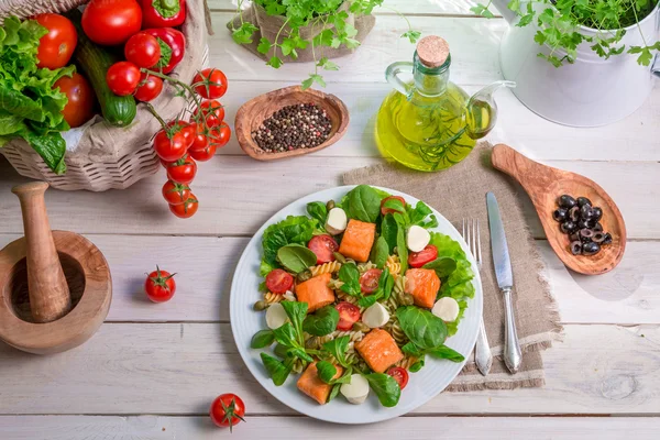 Fresh vegetables and salmon as ingredients for salad — Stock Photo, Image