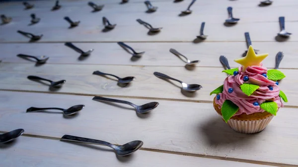 Muffin attacked by spoons — Stock Photo, Image