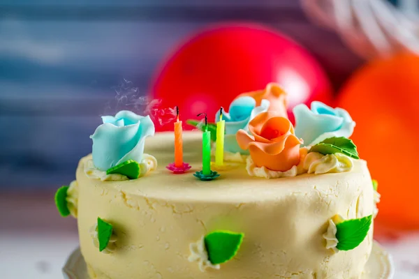 Blown out candles on birthday cake — Stock Photo, Image