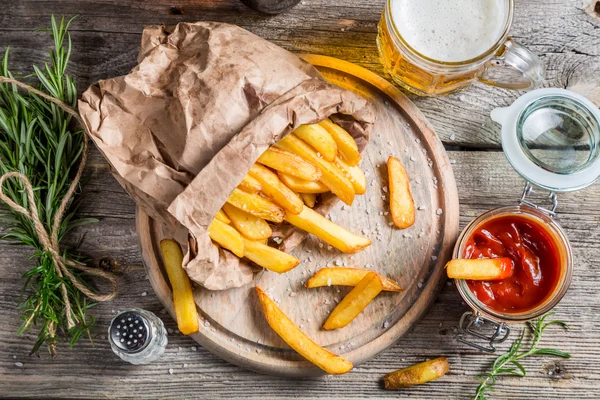 Homemade fries served with beer — Stock Photo, Image