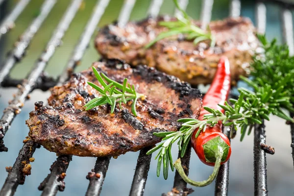 Grilled steak with chilli and rosemary — Stock Photo, Image